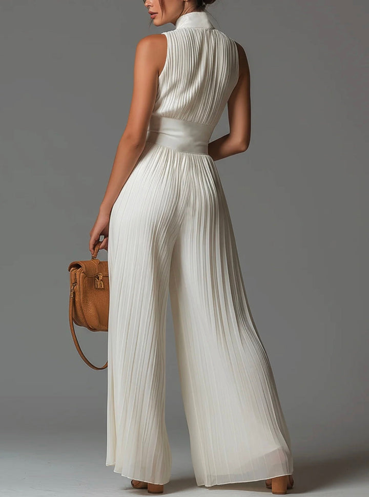 Abigail - Ärmlös jumpsuit i chiffong med V-ringning, dragkedja, veck och vida ben