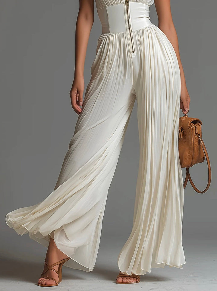 Abigail - Ärmlös jumpsuit i chiffong med V-ringning, dragkedja, veck och vida ben
