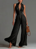 Abigail - Ärmlös jumpsuit i chiffong med V-ringning, dragkedja, veck och vida ben